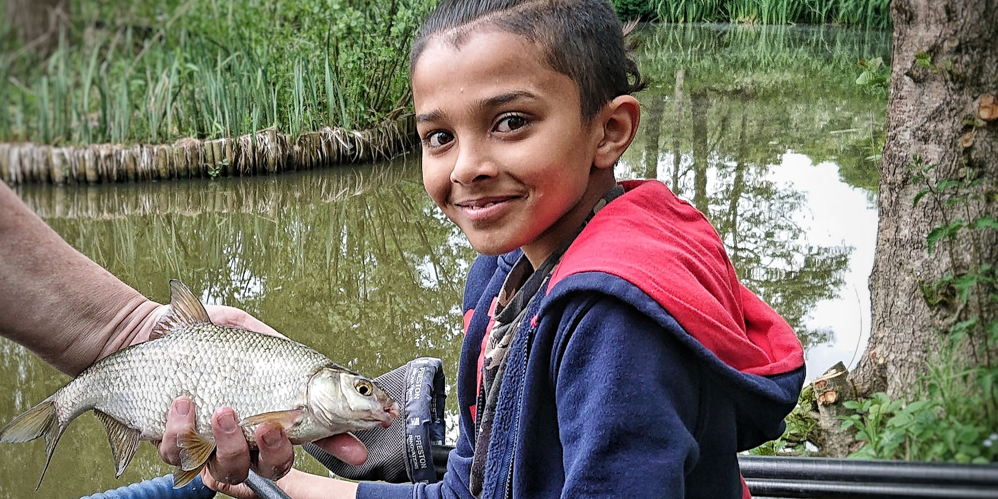 Girl fishing with a skimmer bream