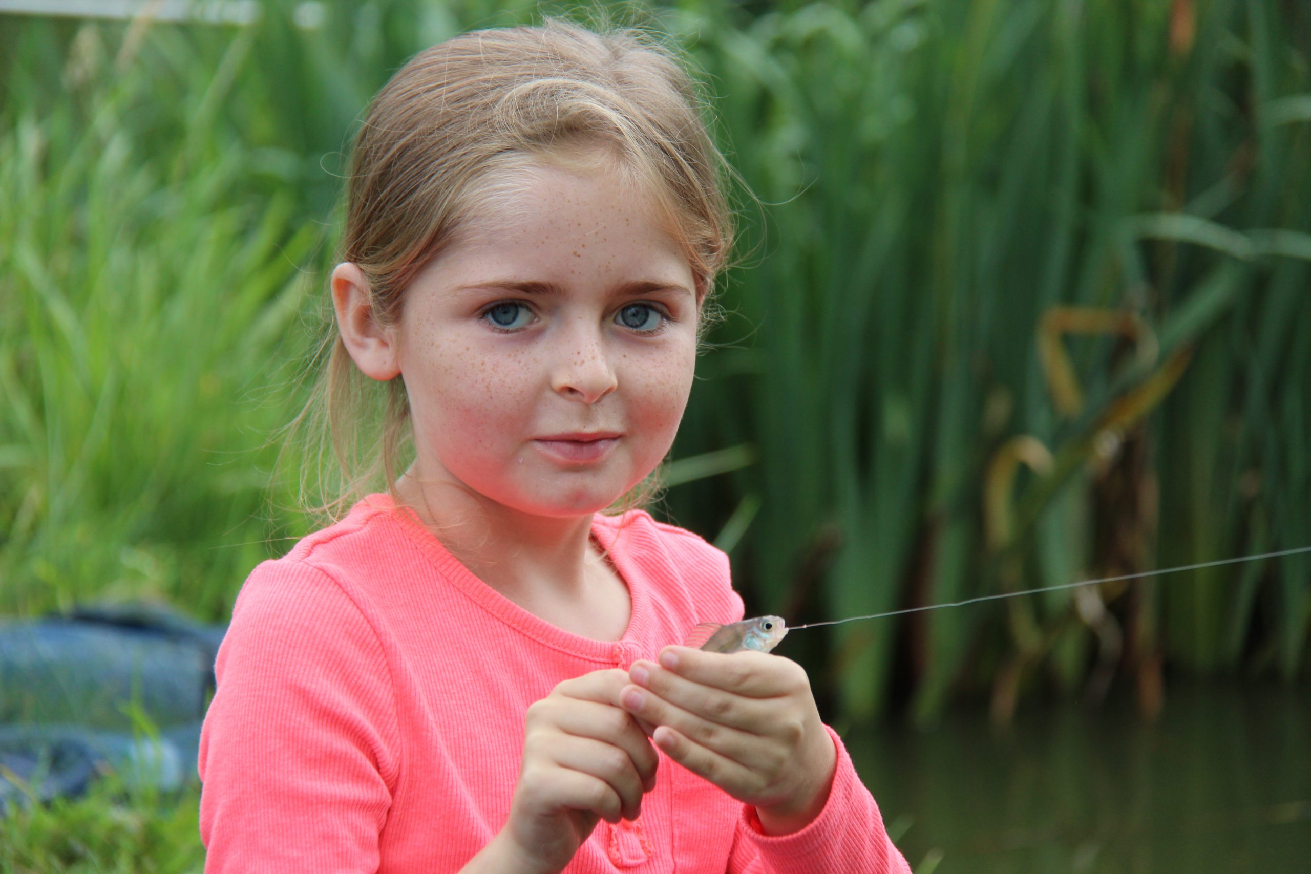 Get Fishing - a young girl with a fish