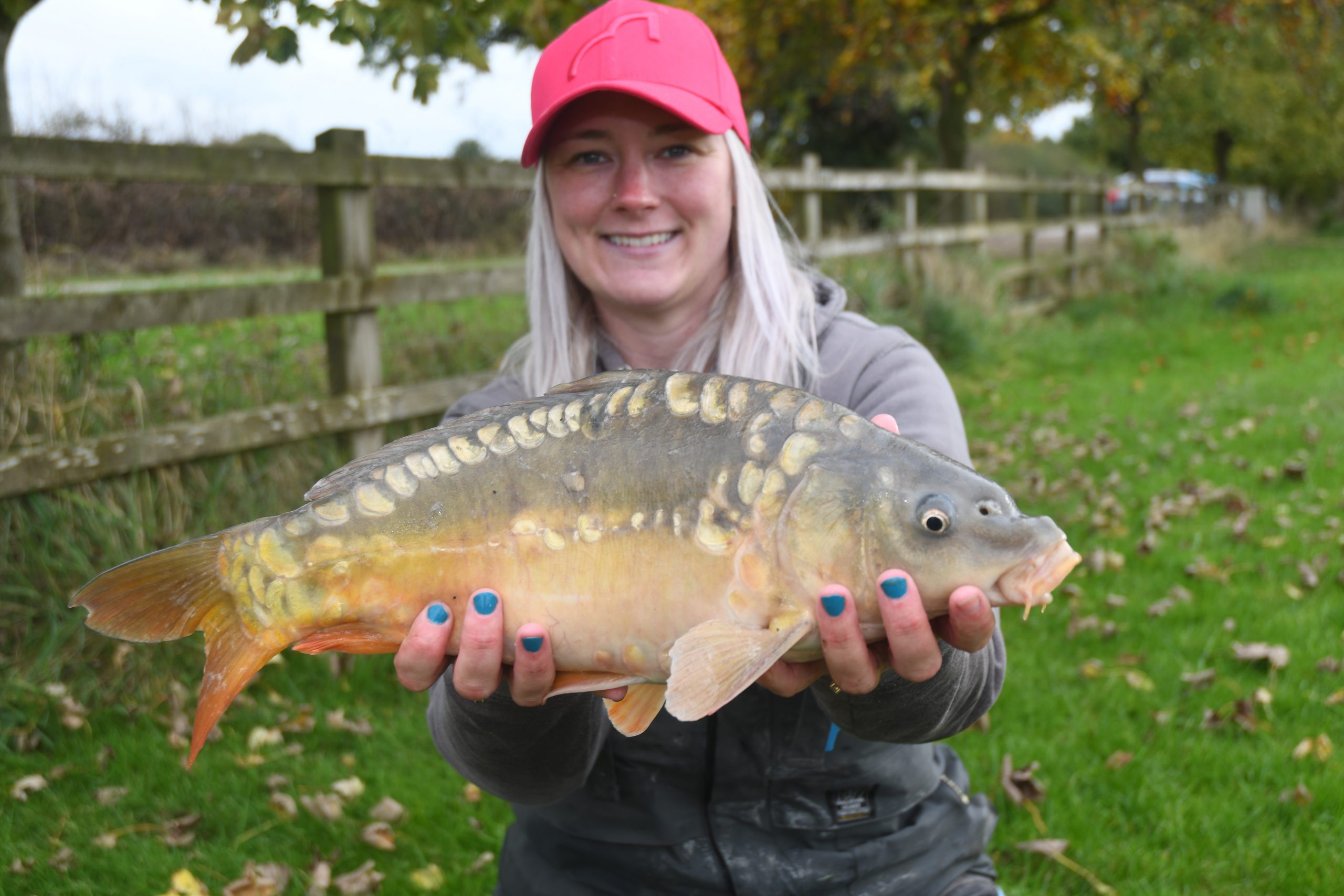 Get Fishing - Emma Harrison Fishing with a carp at a commercial fishery-3