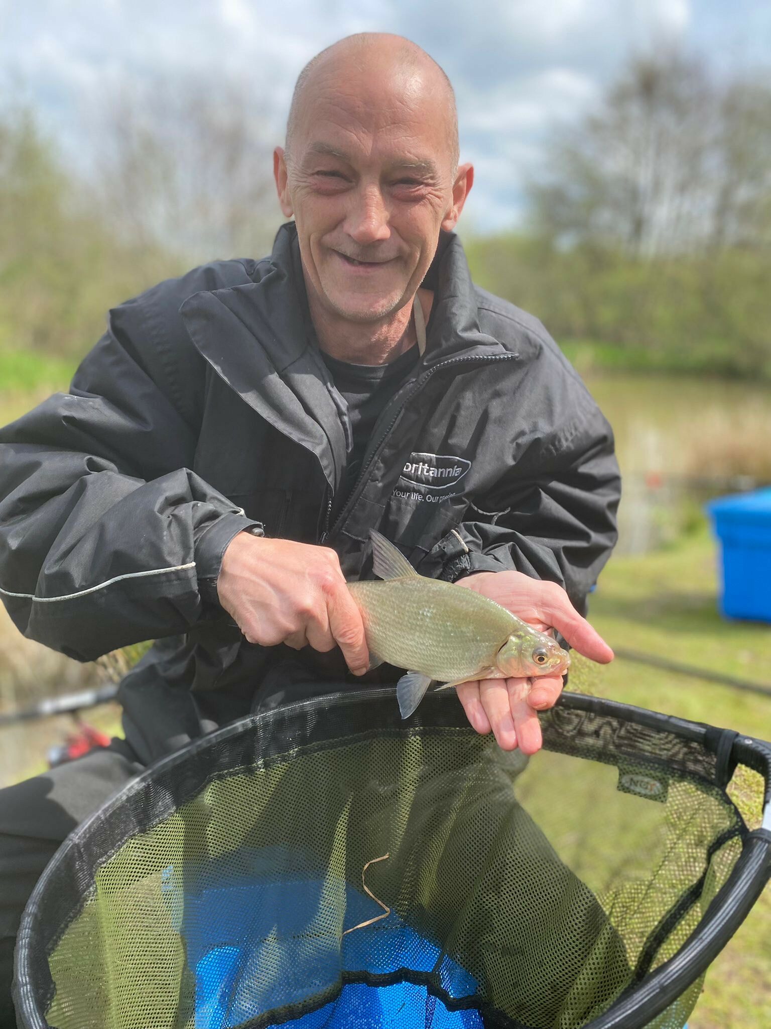 Barry from YMCA Knowsley with his catch and a net